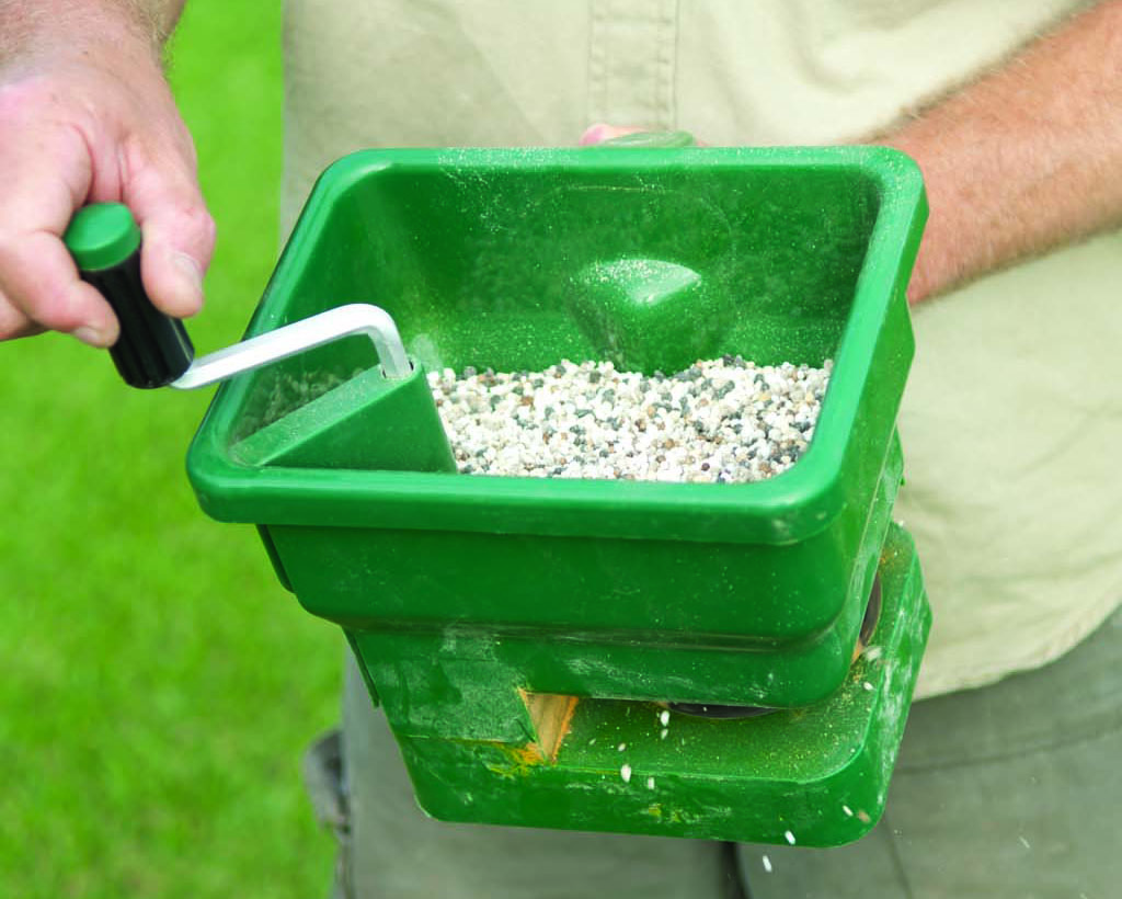 Watering in lawn fertiliser