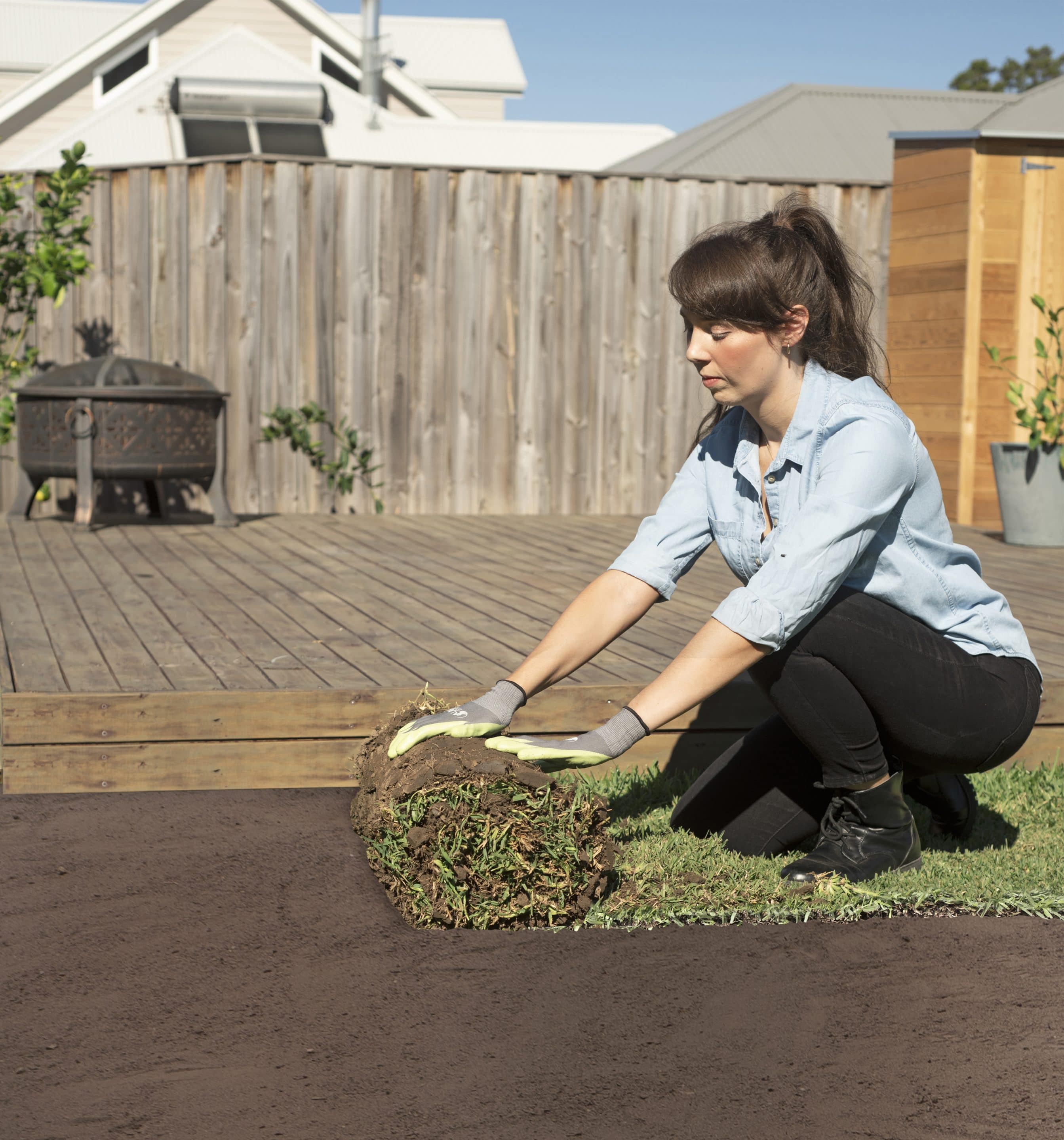 Woman Rolling a new lawn