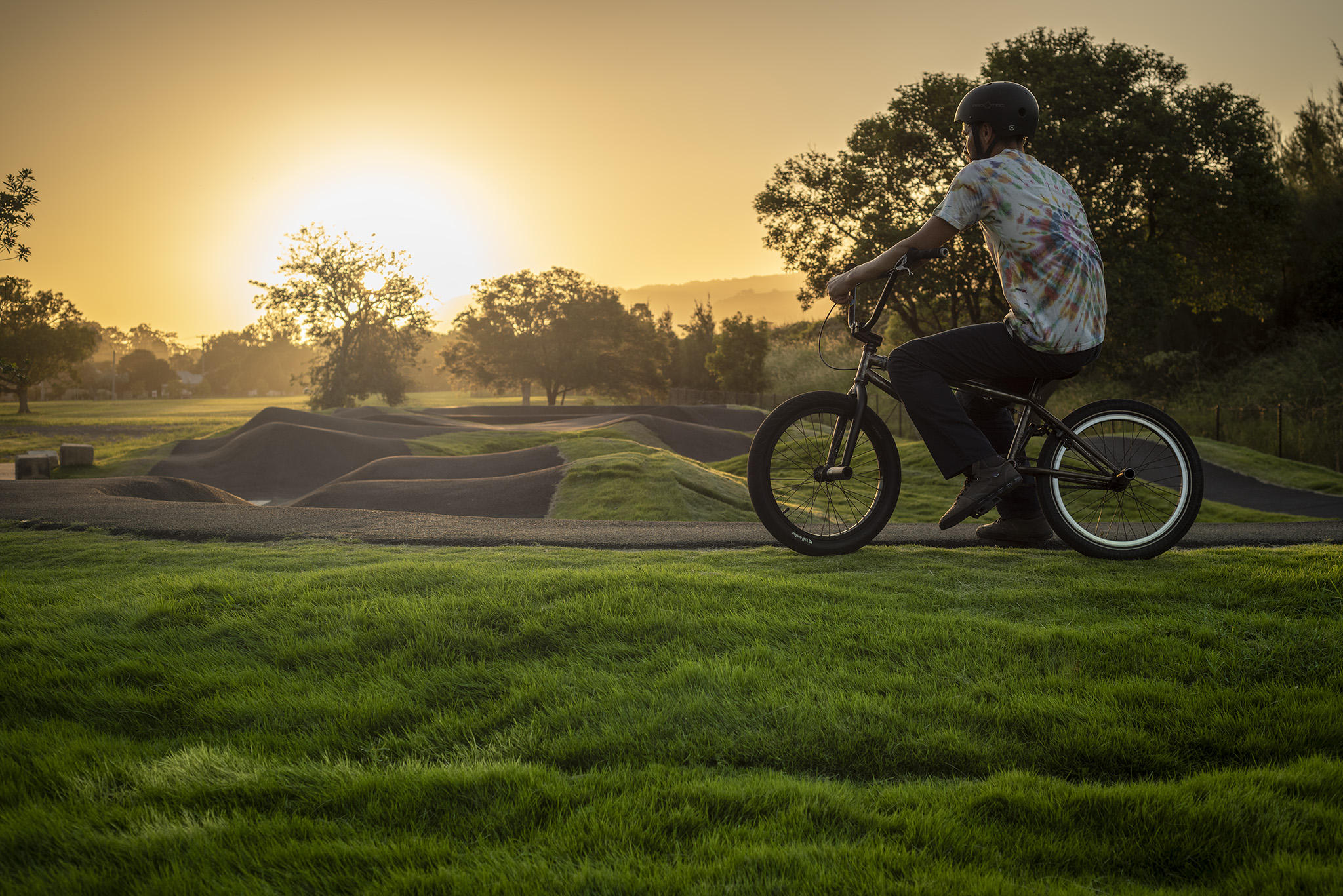 Natural grass at the local skatepark and playground
